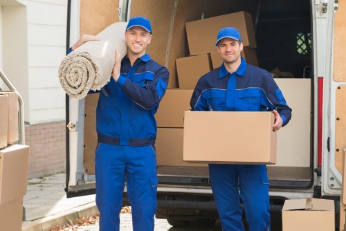 Happy clients with their belongings during a move