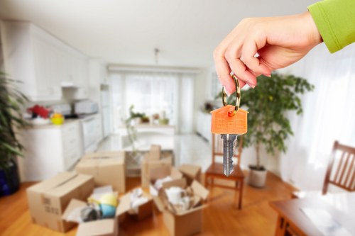 Professional removalists loading a moving van with household items