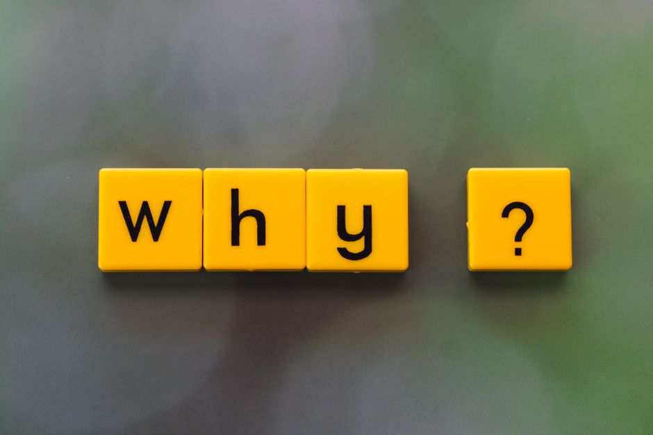 A close-up image features nine yellow letter tiles arranged on a light blue background, spelling out the phrase 'why not try'. The tiles are placed in a grid with three rows, each containing three til